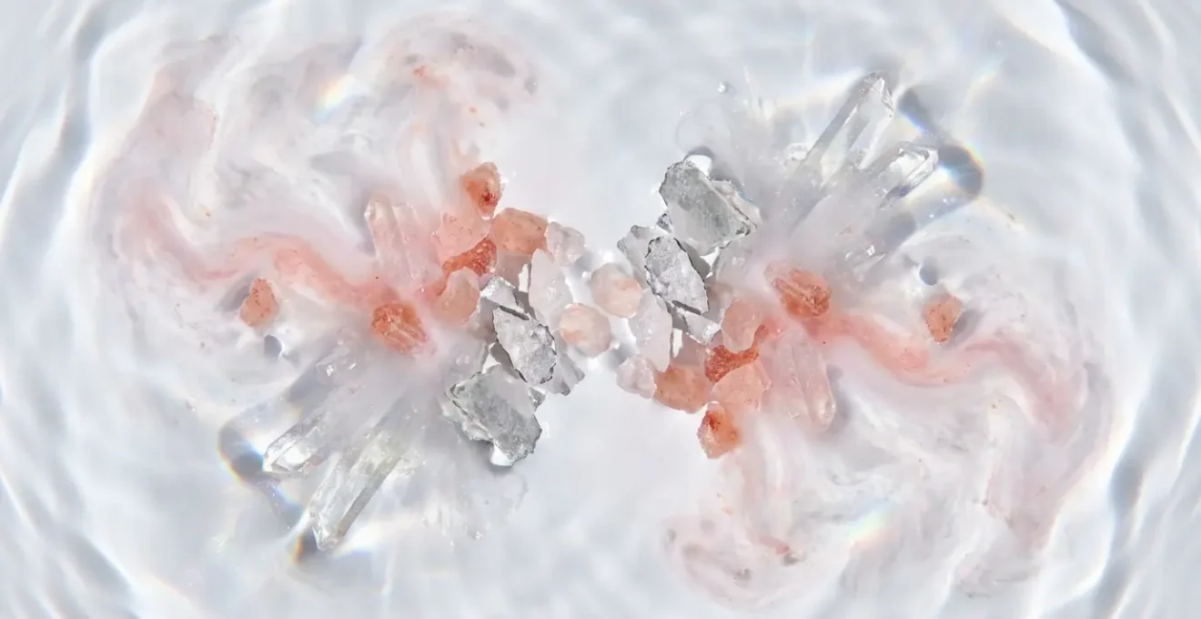 Macro shot of crystalline electrolyte minerals dissolving in water